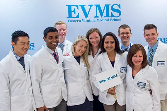 A group of new EVMS students pose for a photo during new student orientation.