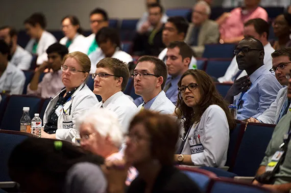 Students and faculty listen during Grand Rounds.