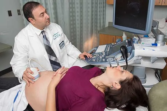 Dr. Alfred Abuhamad performs an ultrasound on a patient.